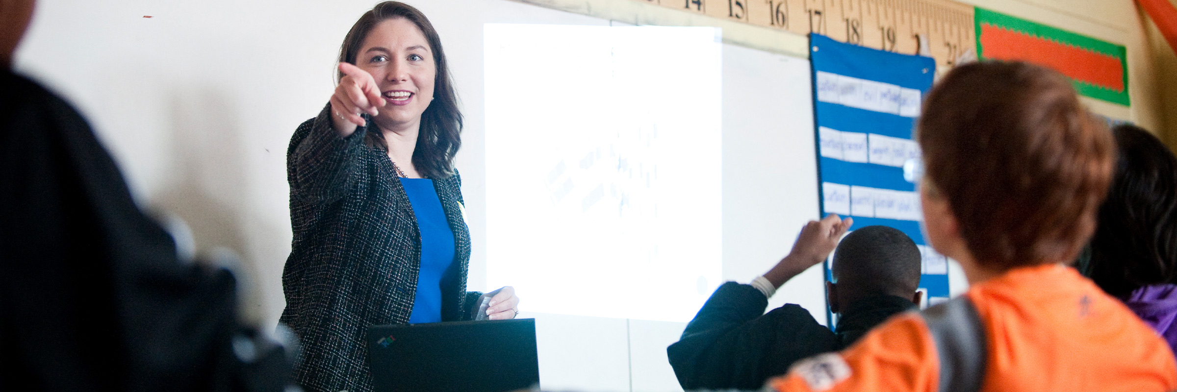 Teacher pointing at a student